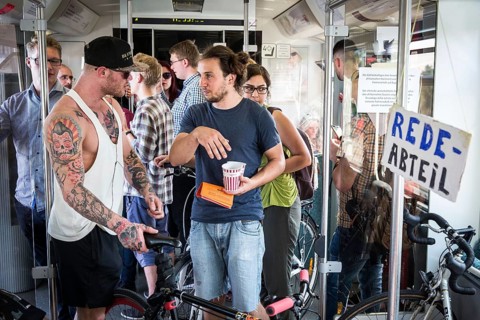 DEU Germany Germany Berlin Students discuss the G20 summit on the Berlin S-Bahn. A loose group of