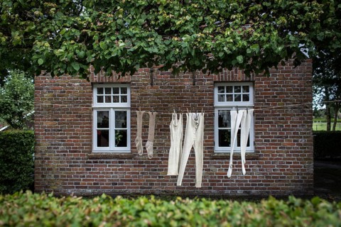 DEU Germany Germany Moordorf Historic clothing hangs on a washing line at the Moor Museum. The