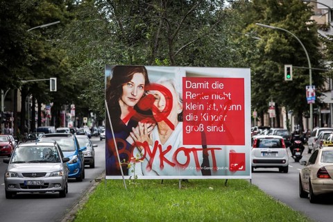 DEU Germany Germany Berlin An SPD election poster on the subject of pensions stands on Sonnenallee
