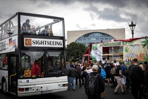 DEU Germany Germany Berlin Scene of the Hanfparade. Sightseeing bus passes the parade