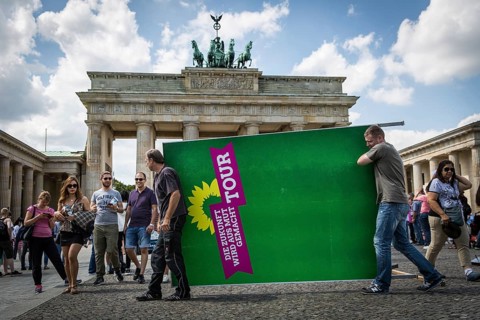 DEU Germany Germany Berlin Two men carry a Green Party billboard across Pariser Platz. After a