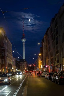 DEU Germany Germany Berlin View through Brunnenstraße with TV tower and moon at the blue hour