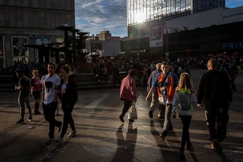 DEU Germany Germany Berlin People in the light at Alexanderplatz