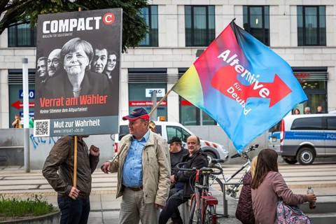 DEU Germany Germany Dresden Pegida demonstration in the city centre. AFD flag and Merkel protest