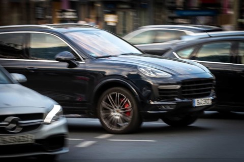 DEU Germany Germany Berlin An SUV, Porsche Cayenne, takes off on the Kudamm