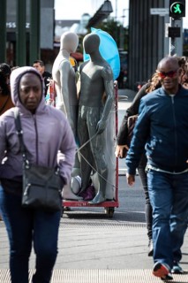 DEU Germany Germany Berlin Pedestrians crossing a street at Potsdamer Platz where mannequins are