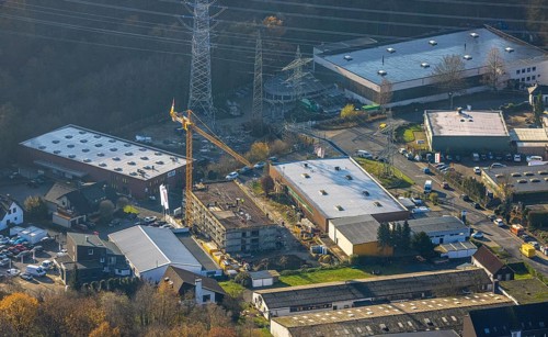 Aerial photo, construction site, construction crane, new building, electricity pylons,