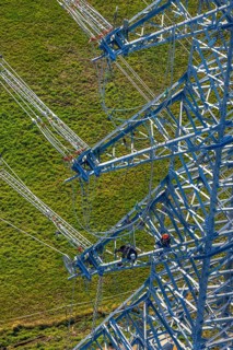 Aerial photo, construction power line Dortmund-Hagen, climber in power pylon, worker, height