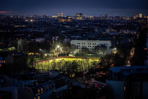 DEU Germany Germany Berlin Floodlights illuminate a sports field in Kreuzkölln