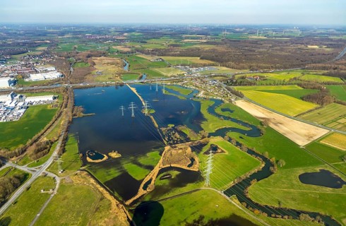 Aerial view, Flooded Lippe floodplain on the A2 motorway, electricity pylons, Uentrop campsite,