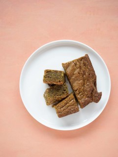 Group of matcha blondies on a white plate, prepared for a sweet treat