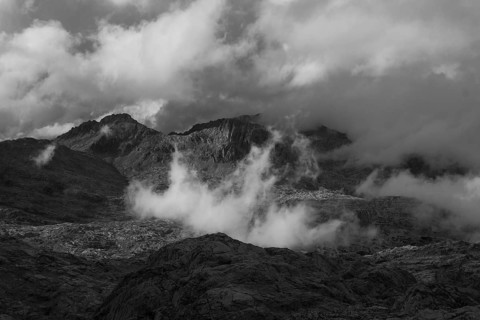 View over the Steinernes Meer Plateau to the summit of the Funtenseetauern with moving clouds,
