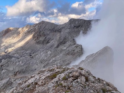 View from the summit of Wildalmkirchl with fog on the southern edge of the Steinernes Meer,