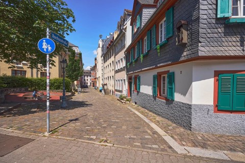 Historic buildings, houses, slate tiles, paving stone sidewalk, road signs special path for