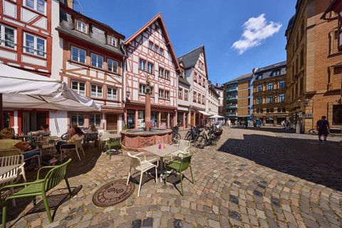 Marienbrunnen, stone fountain, historic half-timbered houses, buildings, bicycles, paving stone