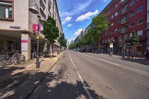 Residential and commercial buildings, general architecture, traffic area, street, lantern, bus stop
