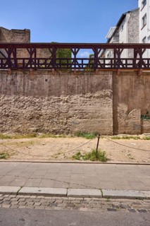 City fortification, historic city wall, general architecture, houses, parking lot, barrier bollard,