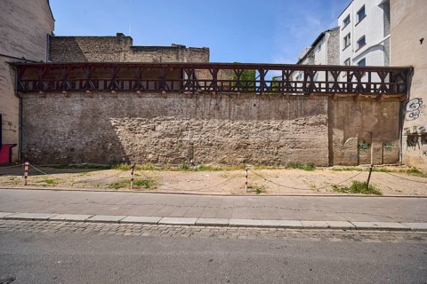 City fortification, historic city wall, general architecture, houses, parking lot, barrier bollard,