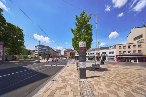 Stele with location sign, traffic area, roads, square, road construction, tram tracks, overhead