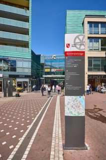 Stele with location sign, Roman passage, shopping center, general architecture, modern building,