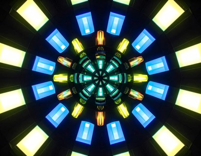 Abstract background of slightly unfocused multicolored glass lenses spinning and rotating,