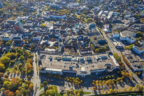 Aerial view, city and construction site with demolition and new construction of the western half of