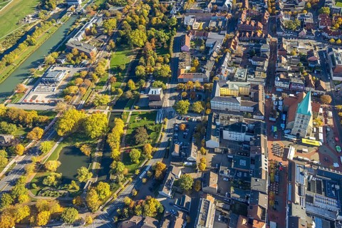 Aerial view, city and evangelical St. Paul's Church and educational center, weekly market market on
