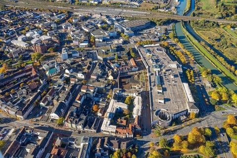 Aerial view, city with construction site demolition and new construction of the western half of the