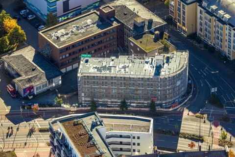 Aerial photo, construction site new apartment building for student living at the intersection Neue