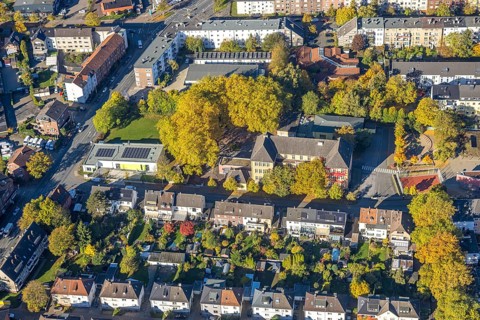 Aerial view, Harkortschule with autumn trees, new teaching pool with solar roof, in the back Kita