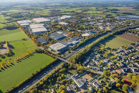 Aerial view, Oberster Kamp industrial estate on the A2 motorway, meadow area surrounded by autumn