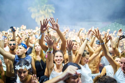EDITORIAL and NEWS ONLY, festival crowd cheering towards stage of rare moment of joint DJ back to