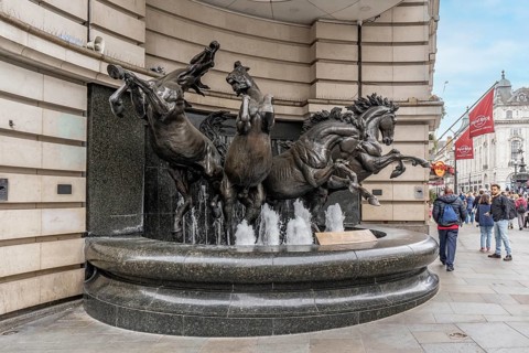 London, United Kingdom - 15 May 2025: Bronze sculpture of The Four horses of Helios fountain in