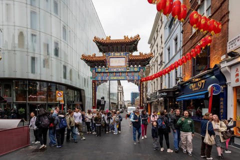 London, United Kingdom - 15 May 2025: Iconic paifang gate marking the vibrant entrance to London's