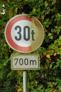 Raesfeld, NRW, Germany, Old traffic sign indicating a 30-ton weight limit ahead for 700 meters