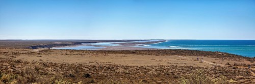 Pristine coastal plain extending into the expanse of the blue sea, the countryside of Peninsula