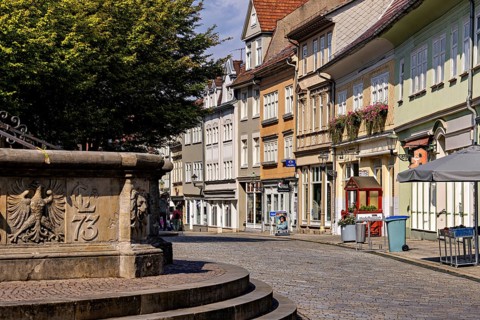 Historic street with facades and a fountain on the cobblestones, The old town of Arnstadt in