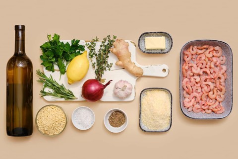 Ingredients for making risoni pasta with shrimp including white wine, parsley, lemon, thyme,