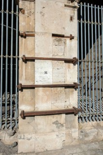 Pillar element made of travertine stone from Colosseum with architectural measure used in the