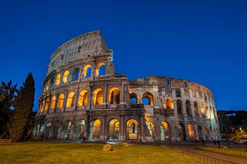 Night view photo in Blue Hour of Amphiteatrum Flavium Colosseum Colosseo in ancient center of Rome,