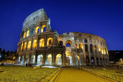 Night view photo in blue hour of historic arena Amphiteatrum Flavium Colosseum Colosseo in ancient