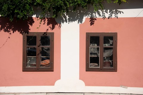 Pink house facade, window with old objects, Kranj, Upper Carniola, Slovenia