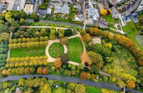 Aerial view, municipal park and autumn trees on the river Niers, tree-lined avenue and circular