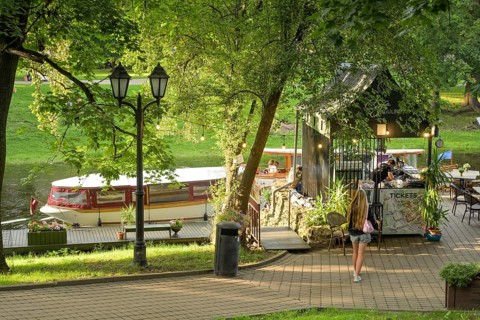 People, leisure, sightseeing boat, city canal, municipal park, Riga, Latvia