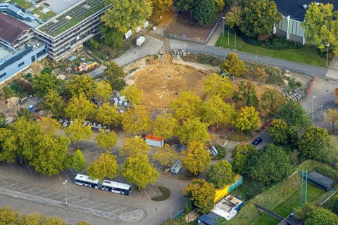 Aerial view, construction site An de Tent, between round sports hall and parking lot, Fusternberg,