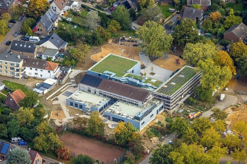 Aerial view, Fusternberg community elementary school construction site, green roof and solar roof,