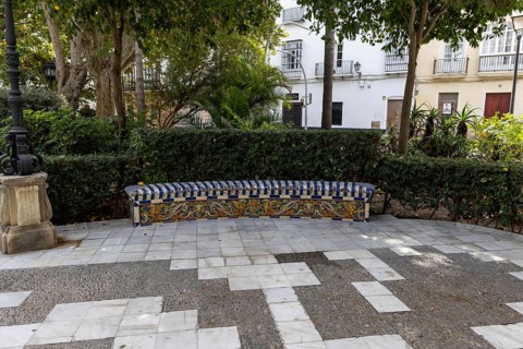 Beautiful natural park with a bunch of tiled park bench, The Ornamental Pond in Genovés Botanic