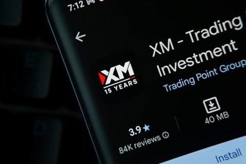 Dhaka, Bangladesh- 27 July 2025: XM Trading app from Google Playstore is displayed on a smartphone