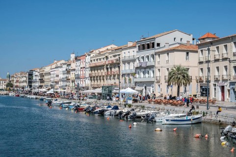The lively promenade of Quai Leopold Suquet along the Canal de Sete, formerly Canal Royal, with a