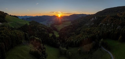 Sunset between the first and second Jura ranges, drone shot, Breitehöchi, Mümliswil, Solothurn,